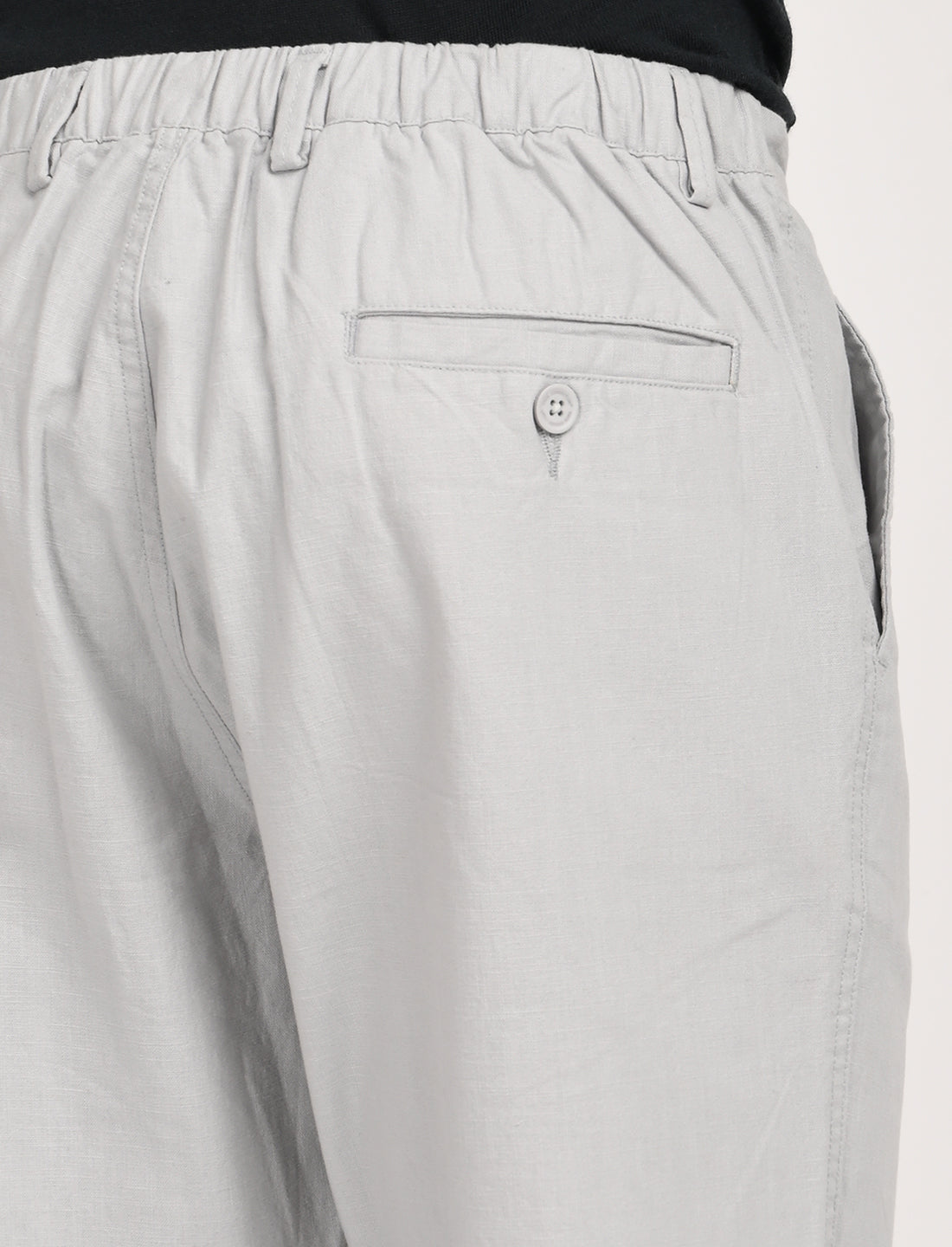 Back view of Nova Light Grey Linen Blend Trouser showcasing elastic waistband and buttoned rear pocket.