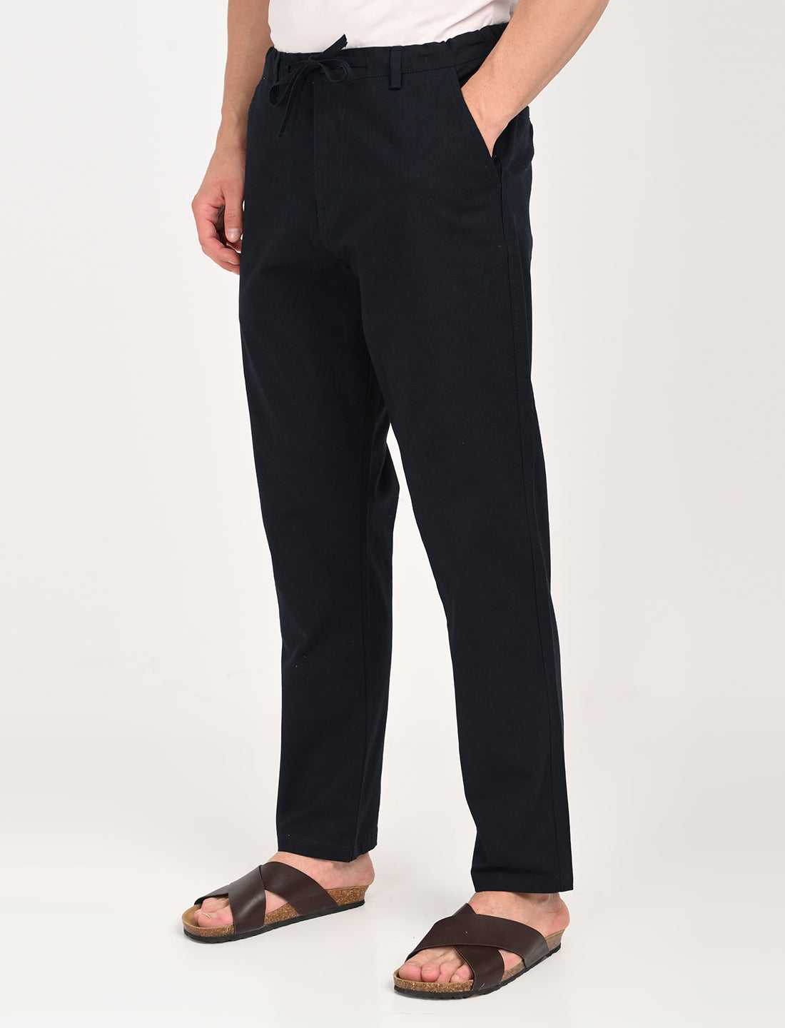 Men's navy blue linen blend trousers styled for casual wear, featuring a regular fit and comfortable design.