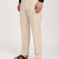 Men's cream linen blend trousers with a relaxed fit, worn with sandals for a casual look.