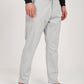 Light grey linen blend trousers with a drawstring waist, styled casually with sandals, perfect for relaxed outings.